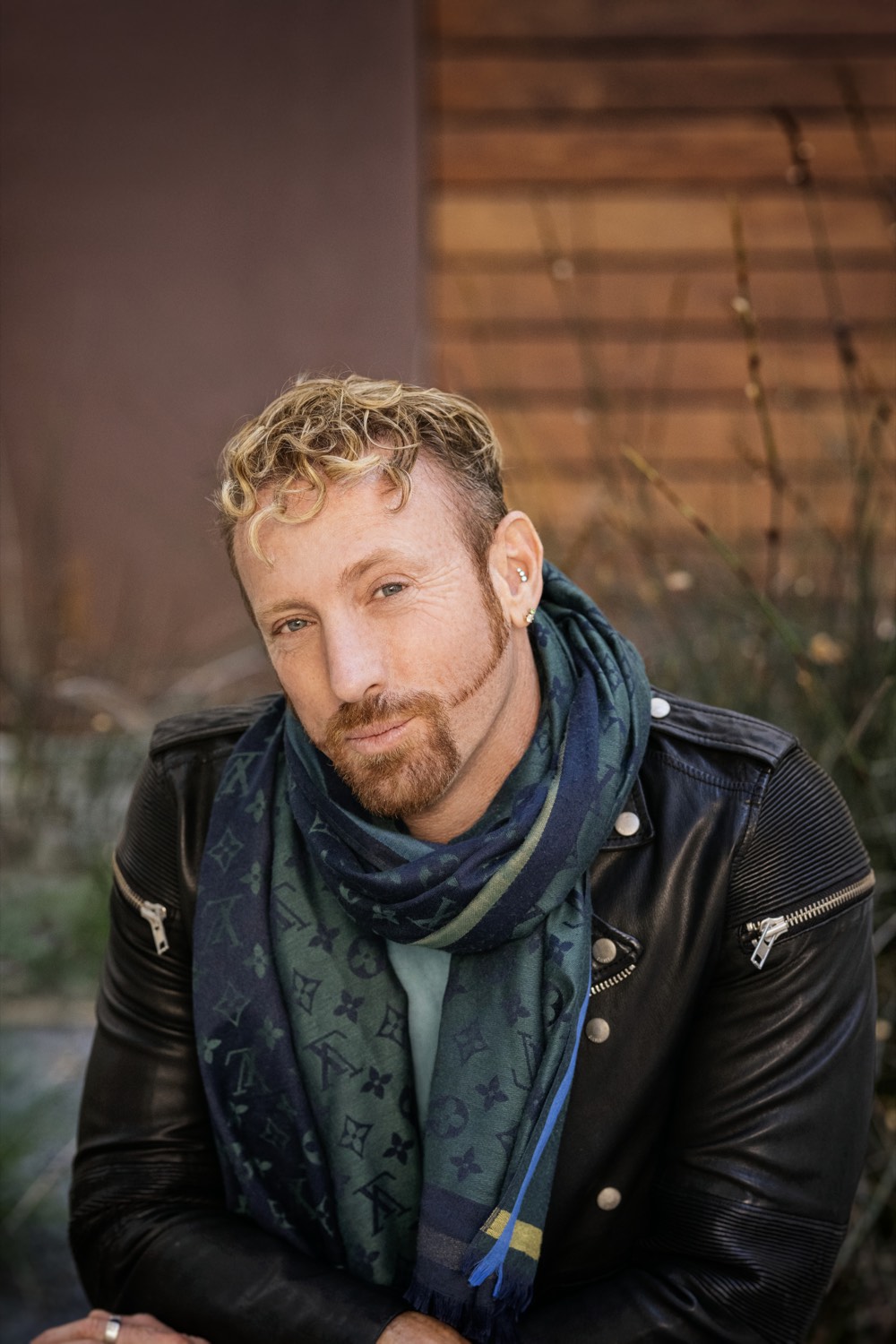 Brook Casey in a leather jacket and scarf