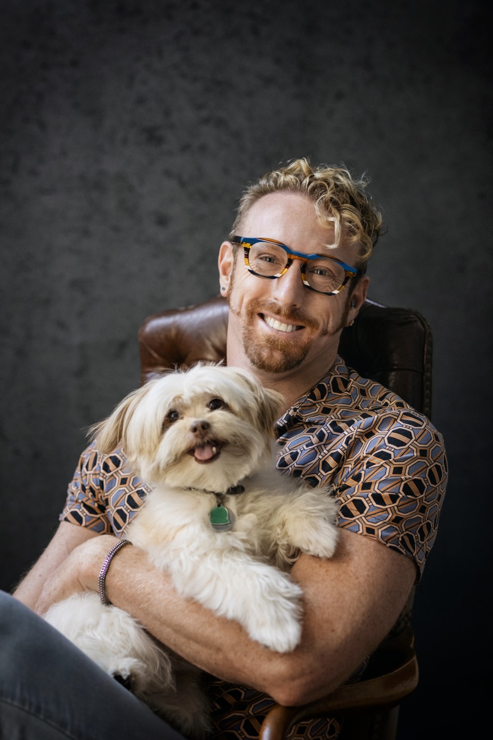 Brook Casey in glasses holding his dog